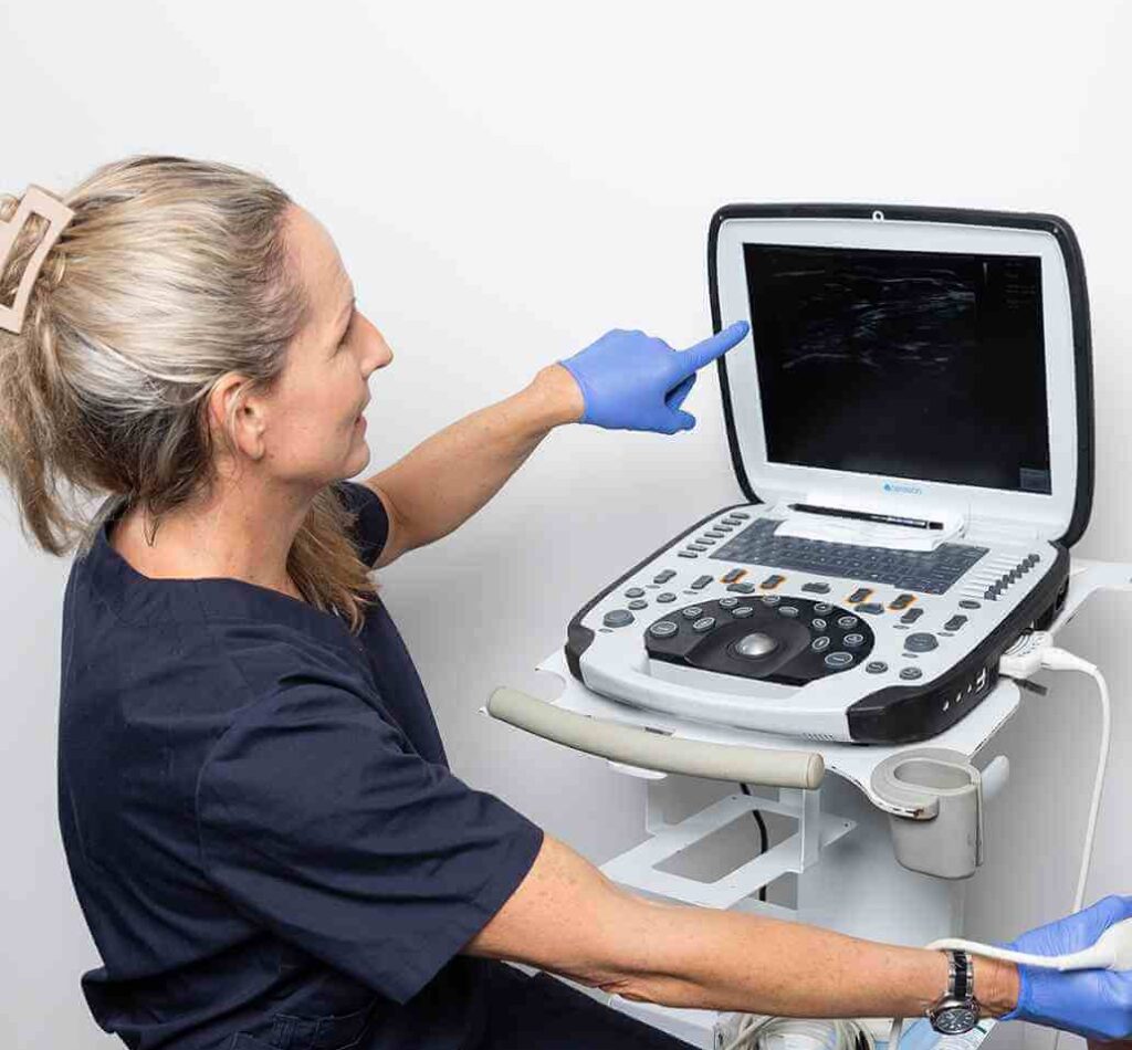 Dr Kim Jackman - Vein Doctor showing patient ultrasound scan